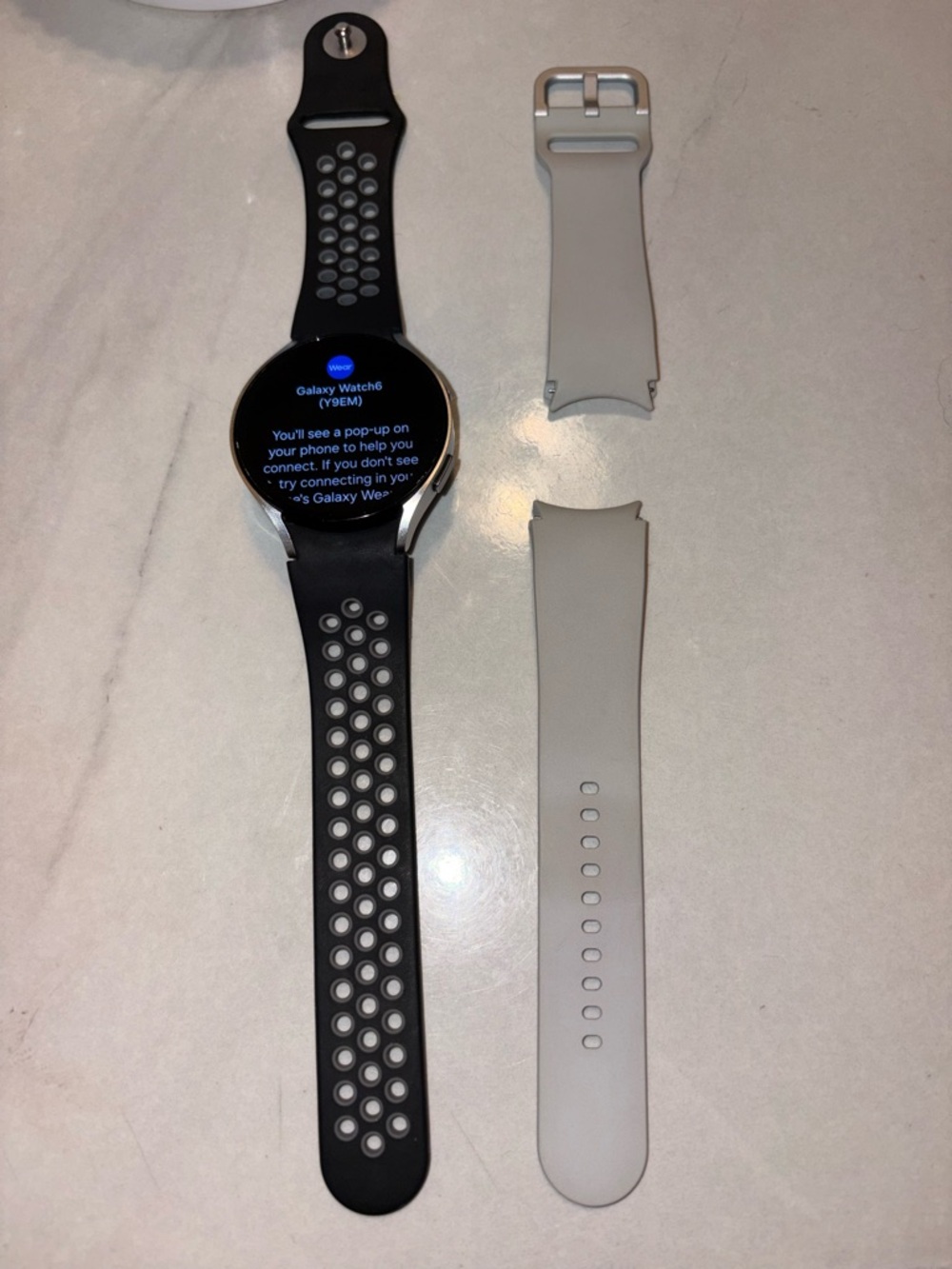 Samsung Galaxy Watch with Black Sport Band and original Light Gray Strap